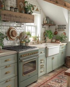 a kitchen with green cabinets and an oven