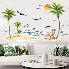 a beach scene with palm trees and birds flying over the ocean wall mural decal