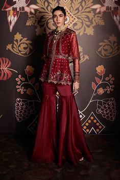 Editor's Note Embroidered Net Cape Peplum And Organza Gharara Paired With Belt Fabric: Peplum: Net, Gharara: Organza Color: Burgundy Care: Dry Clean Only  About the Designer                    ... Organza Gharara, Net Sharara, Organza Sharara, Ridhi Mehra, Raw Silk Lehenga, Net Blouses, Set Saree, Embroidered Crop Tops, Notched Neckline