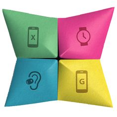 four different colored origami pieces with icons on them