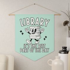 there is a sign that says library it's the best part of the day