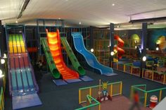 children's play area with slides and climbing walls