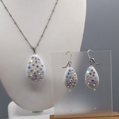 "Milk Glass Teardrop Studded with AB Crystals, Pendant Necklace and Matching Dangle Earrings on Silver Tone Very nice condition. Gently Worn. 16\" with 3\" extender Pendant, 2\" x 1\" Earrings, 2\" x 3/4\" Size: Womens 16\" with 3\" extender Condition: Pre-Owned Good" White Teardrop Pendant Jewelry With Matching Earrings, White Teardrop Jewelry Sets With Matching Earrings, White Crystal Long Drop Jewelry, White Long Drop Teardrop Earrings For Party, White Drop Teardrop Earrings For Party, White Teardrop Pendant Jewelry For Party, White Teardrop Earrings For Party, White Teardrop Jewelry Sets For Party, White Teardrop Pendant For Party