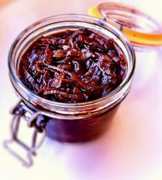 a jar filled with food sitting on top of a table