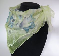 "Hand painted silk chiffon square scarf in shades of green, blue, purple and white. \"Blue Mushroom\" Made with 100% Silk Chiffon. Size: 20x20 inches (50x50 cm) All items are created in a smoke free environment. CARE   Dry clean or hand wash cold with gentle detergent. Iron face down with paper or cloth underneath. Use the iron setting for silk. Do not apply perfume or cologne to the silk as it can damage the colors. SHIPPING All items posted in my shop are available to ship within 1-3 business Green Square Scarf For Spring, Green Silk Scarf For Summer, Green One Size Scarf As A Gift, Green One-size Scarf As Gift, Blue Mushroom, White Scarf, Silk Scarf Painting, White Scarves, Hand Painted Silk Scarf