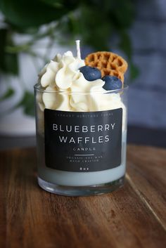 a blueberry waffles candle is sitting on a table