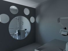 a bathroom with round mirrors on the wall