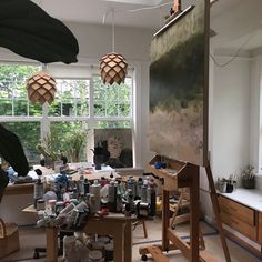 an artist's studio filled with lots of art supplies