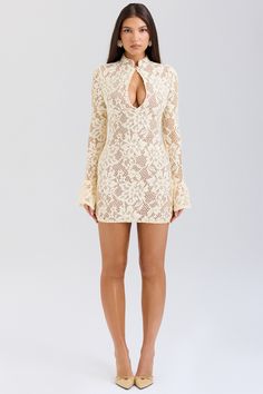 DESCRIPTION: The dress is our beautifully feminine mini dress in a delicate floral lace. This enchanting design features a high neck and a peek-a-boo keyhole front. It has a bodycon silhouette for a snatching fit. enhanced by the inner mesh layer that also works well for the perfect coverage. The long sleeves have pretty fluted cuffs and it zips to the side for easy on. For the most elegant look. pair yours with vertiginous tonal heels.  WHERE TO WEAR: Pretty date nights. romantic dinner dates. First Day Outfit, White Prom Dress, Bandage Dress Bodycon, Bridal Shower Dress, Romantic Dinner, Jumpsuits And Romper, Graduation Outfit, Feather Dress, Puff Sleeve Dresses