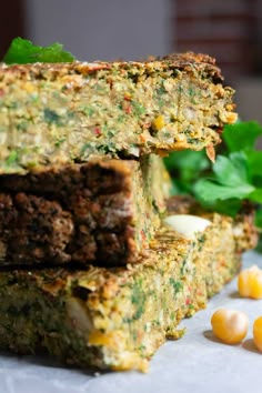 some food is stacked on top of each other and ready to be eaten with corn in the background