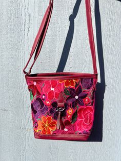 *Please advise each bag has a different design and color background. It might not be the exact flowers/ color background as the image. If you want a specific design please message us for photos* The vibrant embroidered flowers that are carefully crafted by artisans in Mexico bring beauty to this bag. You can style this as a shoulder or crossbody bag for any occasion.Measurements: 10 inches (width) x 8 1/2 (length)Made with Synthetic Faux Leather-Adjustable straps-Zipper closure pocket-Back Zippe Flowers Color, Navy And Brown, Color Background, Charcoal Color, Embroidered Flowers, Colorful Flowers, Zipper Pocket, Dark Brown, Adjustable Straps