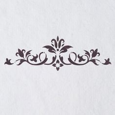 an ornate design on white paper with black ink