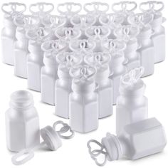 white plastic bottles with lids and clips for hairbrushes, toothpaste or other items