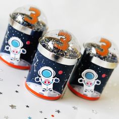 three space themed salt and pepper shakers