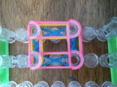 several plastic objects sitting on top of a wooden table