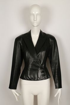 Jet-black, butter-soft leather jacket designed by Azzedine Alaia dating to late 1980's. Jacket has a very flattering silhouette with a fitted waist, slightly flared hemline and beautiful topstitched seams. Labeled a French size 38. Approximate measurements: shoulder 16", bust 34", waist 28.5", arm length from shoulder seam to cuff 23" and overall length at center back (with collar) 22". Button closure. Fully lined. Made in France. Very good condition. Classic Long Sleeve Leather Jacket For Evening, Designer Fitted Leather Jacket For Evening, Designer Fitted Leather Jacket For Office, Vintage Formal Fitted Leather Jacket, Vintage Fitted Leather Jacket For Formal Occasions, Classic Leather Jacket For Night Out, Fitted Leather Jacket For Evening, Fitted Leather Jacket For Formal Winter Occasion, Fitted Leather Jacket For Evening In Winter