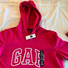 Never Worn Sweatshirt Hoodie By Gap. Size M Bubble Gum Pink Color. Has A Hood And A Front Pocket Gap Sporty Sweatshirt For Fall, Sporty Gap Sweatshirt For Spring, Casual Ribbed Cuff Tops By Gap, Casual Gap Tops With Ribbed Cuffs, Gap Sporty Long Sleeve Tops, Sporty Long Sleeve Tops By Gap, Gap Sweatshirt With Letter Print For Streetwear, Gap Casual Sweatshirt For Spring, Gap Casual Spring Sweatshirt