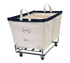 a white and blue shopping cart with wheels on the bottom, holding a canvas tote bag