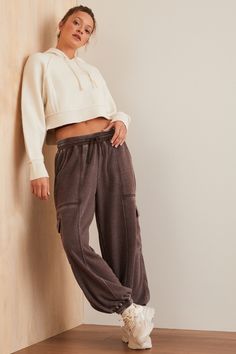 These cargo joggers combine style and comfort with their warm fleece interior, perfect for chilly days. The drawstring waistband ensures a personalized fit, while the multiple cargo pockets offer ample storage for your essentials on the go. White Dress Skirt, Skirts With Boots, Performance Leggings, Leg Day, Cargo Joggers, Active Leggings, Altar'd State, Legs Day, Drawstring Waistband