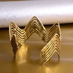 Zig Zag Bangle, Hammered Wave Bangle, Stacking Bangle, Wave Bangle, Handmade Bangle, Textured Bangle, Brass Bangle, Gift For her 1. Please share your numbers (in personalization box ) as required for shipping address details, and it'll help us to contact you easily. And don't worry about the privacy, we'll keep it safe with us, So try to cooperate with us. :) 2.Customers' satisfaction is our biggest priority, please contact us with any questions/queries for future or existing orders, and we will do our best to make sure you are happy with your order. 3.Please make sure to add the correct address during checkout. You can return your purchased item within 15 days after successful delivery. We offer a 100% "Money Back Guarantee" if you are not satisfied with your purchase. Return charges will Adjustable Brass Bracelets For Party, Adjustable Brass Bangle For Party, Zig Zag Bracelet, Bangle Bracelet Gold, Classic Bangles, Stackable Bangles, Brass Bangle, Handmade Bangles, Stacked Bangles