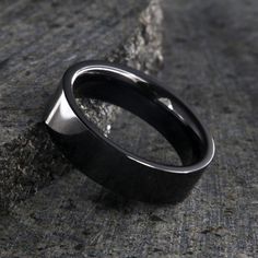 Stunning 6mm black ceramic rings with a perfect diamond polish finish. All ceramic jewelry includes our deluxe inside comfort fit design. 6mm wide black ceramic ring Polish finish Flat profile Inside Comfort Fit Design Scratch Resistance Luxury Black Engraved Ring With Polished Finish, Luxury Handmade Black Men's Ring, Luxury Classic Men's Ring With Black Enamel, Modern Black Titanium Jewelry, Luxury Black Minimalist Men's Ring, Black Titanium Jewelry With Polished Finish, Elegant Black Tungsten Carbide Rings, Luxury Onyx Men's Ring With Polished Finish, Modern Black Tungsten Carbide Jewelry