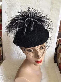 "Vintage 1970's dark Black Wool Felt hat. Has veiling with Black and White feathers. Label is *Miss Bierner*. Made in USA. *MORE INFORMATION BELOW* CONDITION: No issues noted. MEASURES: Inside circumference~21\" Front to back~7\" Left to right~8\" *WE APOLOGIZE~BUT WE NO LONGER SHIP TO GERMANY, ITALY OR SPAIN. IF ORDERS COME IN FROM GERMANY, ITALY OR SPAIN, WE WILL HAVE TO CANCEL THEM AND REFUND YOUR MONEY. SORRY FOR THIS INCONVENIENCE*" Black Brimmed Fall Costume Hat, Black Brimmed Costume Hat For Fall, Brimmed Black Costume Hat For Fall, Black Brimmed Mini Hat For Fall, Black Mini Hat With Short Brim For Fall, Black Wide Brim Costume Hat For Fall, Black Wide Brim Hat For Fall, Fitted Black Costume Hats For Fall, Fitted Black Costume Hats And Headpieces For Fall