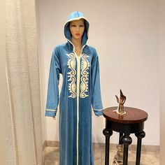 Blue Velvet Abaya Embroidered With Light Gold With Hood And Belt On Waist For Adjustment Can Be Worn For S,M,L Traditional Blue Abaya With Dabka, Blue Long Sleeve Thobe With Dabka Details, Blue Long Sleeve Thobe With Dabka, Blue Embroidered Long Abaya, Embroidered Blue Long Sleeve Abaya, Embroidered Blue Thobe, Velvet Abaya, Modern Kaftan, Short Kaftan Dress