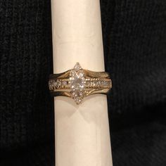 a diamond ring sitting on top of a white napkin