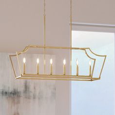 A beautiful UHP4260 Traditional Chandelier from the Coronado Collection by Urban Ambiance, hanging over a dining room table. Transitional Kitchen Island Lighting, Transitional Chandelier, Indoor Chandelier, Rectangular Chandelier, Urban Rustic, Open Frame, New Traditional, Outdoor Light Fixtures