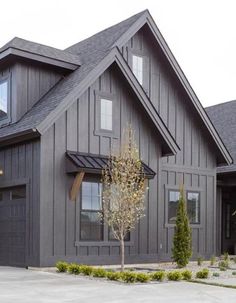 a large house with two garages and three windows