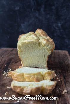 a loaf of bread sitting on top of a wooden cutting board