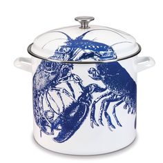 a blue and white casserole with an image of a crab on the lid