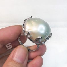 Very unique Baroque pearls adjustable band ring, pearls sized 16x23mm with strong luster which is a statement! With well-made sterling silver band, protect and goes well with the shape of pearls, makes the shape of pearl more special, every pearl has been picked by myself, to make sure the shape is intersting and the luster is good enough. Quality: AAA Color: Natural White Luster: highest sheen and luster Nacre: lustrous and thick nacre Blemish: 97% - 99% Clear Shape: Baroque Size:16x23mm approx Silver Pearl Ring With High Luster For Gift, Silver High Luster Pearl Ring For Gift, Fine Jewelry Silver Pearl Ring With High Luster, Silver Pearl Ring With High Luster, Silver High Luster Pearl Ring Fine Jewelry, Luxury High Luster Pearl Ring In Silver, Luxury High Luster Silver Pearl Ring, Big Pearl, Statement Ring Silver