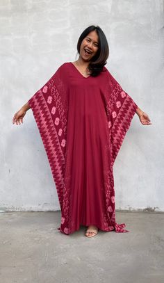 Indulge in the beauty of our classic kaftan with hand silk-screen printed fabric. This kaftan dress boasts unique patterns on high-quality rayon fabric. Its versatile design allows you to create many stylish looks, ensuring you always feel your best, whether you're at home or stepping out. Red V-neck Free Size Kaftan, Traditional V-neck Maxi Dress With Batik Print, Traditional Printed Patterned Kaftan, Traditional Patterned Printed Kaftan, Traditional Flowy V-neck Kaftan, Traditional Patterned Kaftan With Batik Print, Festival V-neck Kaftan With Block Print, Printed Flowy Traditional Kaftan, Traditional Flowy Printed Kaftan