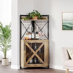 a wooden cabinet with wine glasses and bottles on it in a living room area next to a couch