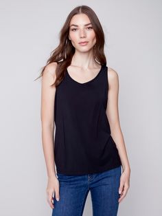 Description Stock up on this versatile tank top for women – it’s reversible, meaning you can wear it with the front scoop neckline, or the other side’s V neckline. New day, new shirt! Available in all the must-have neutrals. Go back to basics in this Black camisole for women. Front crew neck, back V neckline Reversible women’s top Relaxed fit Why we love it Made from the cellulose of bamboo, you’ll love the silky, soft feel of this women’s camisole. It’s the perfect layering tank top, and it’s e Versatile Sleeveless Blouse For Everyday, Everyday V-neck Top With Built-in Bra, V-neck Top With Built-in Bra For Everyday, Everyday Scoop Neck Top With Built-in Bra, Versatile Tank Top, Versatile Everyday Tank Top With Built-in Bra, Versatile Tops With Built-in Bra And Scoop Neck, Versatile Tops With Built-in Bra For Layering, Versatile Camisole Tank Top For Layering