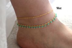 Brilliant crystal beads and tiny golden balls drape gracefully on golden chains to create these flirty and fun gold anklets. Each gold plated anklet is adjustable between 9 - 11 inches in length. Need a different length? Please contact me and I will be very happy to help you! These anklets are available in black, peach, mint, red, blue, and fiesta colors. Please select your preferred crystal color when checking out. ◊ Shipping & Store Policies ◊ Please refer to my Shipping & Policies her Bohemian Gold Anklets With Round Beads, Gold Anklets With Tiny Beads As Gift, Gold Beaded Anklets For Gift, Gold Bohemian Anklets With Beaded Chain, Gold Bohemian Beaded Chain Anklets, Fiesta Colors, Anklet Gold, Anklets Boho, Dripping Springs