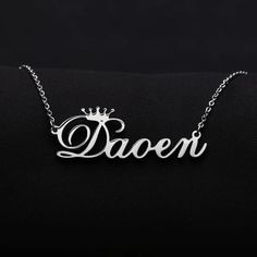 Personalized Crown Name Necklace is a personalized custom cursive font single name necklace gifted with the spirits of absolute glimmer. This beautiful piece of necklace with the queen's crown is an identical design that delivers the royal impression. The nameplate of the necklace can carry up to 10 letters of your choice for all the four types of custom chain lengths. Here we apply a crown symbol on top of the first letter of the name. Consider it as an added bonus to boost the prestigiousness Silver Jewelry With Custom Text For Birthday Gift, Customizable Silver Letter Name Necklace, Elegant Custom Text Nameplate Necklace, Silver Nameplate Necklaces With Custom Text, Custom Text Silver Nameplate Necklaces, Silver Nameplate Necklace With Custom Text, Customized Silver Letter Name Necklace, Silver Necklaces With Custom Text For Birthday, Elegant Silver Name Necklace With Custom Text