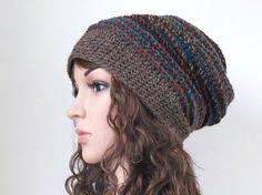 Winter hat for women and teens in earthy brown and teal blue tones. This warm and chunky crochet wool slouchy has a nice textured feel and great rustic look.  Designed and lovingly handmade by me. Yarn: 20% Wool, 80% Acrylic Size: Average size (Approx. 22in./56cm head circumference) Care: Hand wash in cool water. Lay fat to dry. Ready to ship. To see more women's hats, click here: http://www.etsy.com/shop/MinnaMatildaDesigns To see cowls and scarves click here https://www.etsy.com/shop/MinnaMati Brown Beanie, Earthy Brown, Crochet Wool, Men's Hats, Women's Hats, Chunky Crochet, Winter Hats For Women, Slouchy Hat, Hat For Women