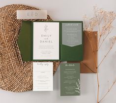 the wedding stationery was done in green and white, along with matching envelopes