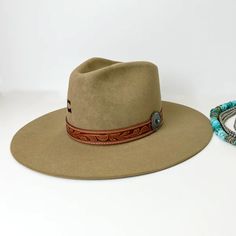 Charlie 1 Horse | Lori Wool Felt Hat with Leather Tooled Band and Silver Concho in Fawn Brown M | Trendy pieces for all shapes and sizes. Southwestern Wide Brim Felt Hat For Western-themed Events, Western Wool Fedora For Kentucky Derby, Wool Felt Hat With Flat Crown For Country Events, Western Wool Hat Bands For Ranch, Fur Felt Fedora With Flat Brim For Rodeo, Western Wool Felt Hat With Flat Crown, Southwestern Felt Hat With Curved Brim For Country Events, Southwestern Curved Brim Felt Hat For Country Events, Country Style Wide Brim Felt Hat For Kentucky Derby