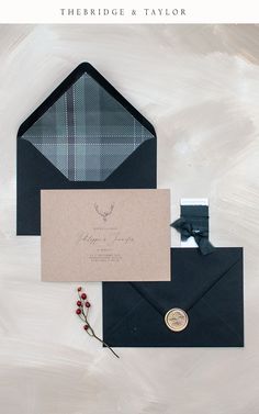 the wedding stationery is laid out on top of an envelope