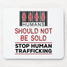 a barcode mouse pad with the text humans should not be sold stop human trafficking