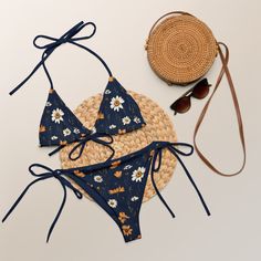 The trendy navy blue triangle bikini set with meadow flowers gives bohemian vibes. The lining is navy blue. Perfect boho-chic bikini is available in sizes up to 6XL. Straps can be tied in multiple ways. This design on the bikini top and bottom are also sold separately. Please check the sizing chart between the listing photos. Item description: - fabric composition in Latvia: 88% recycled polyester, 12% elastane, - fabric composition in Mexico: 81% recycled polyester, 19% Lycra spandex, - soft an Summer Navy Triangle Top Swimwear, Navy Triangle Top Swimwear For Summer, Summer Style Navy Triangle Top Swimwear, Floral Print Swimwear For Festival Beachwear, Festival Floral Print Swimwear Beachwear, Festival Floral Print Beachwear Swimwear, Festival Floral Print Swimwear, Navy Triangle Top Swimwear For Beach, Navy Swimwear For Summer Beach Party