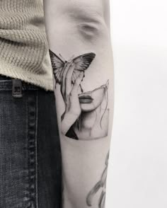 a woman's arm with a tattoo on it