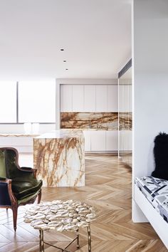 a living room filled with furniture and white walls