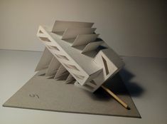 an architectural model with a pencil sticking out of it