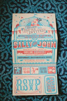 an old style concert ticket is on the ground with blue and red designs around it