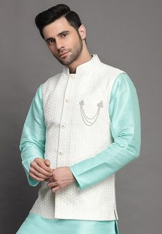 Art Silk Nehru Jacket in Off WhiteThis Readymade Sleeveless attire is Enhanced with Buttons and Resham Work. Crafted in Chinese Collar NeckDo note: Brooch and Kurta shown in the image is for presentation purposes only. Half to one inch may vary in measurement. (Slight variation in actual color vs. image is possible) Mens Kurta | Mens Kurta Pajama | Mens Sherwani | Mens Sherwani Sets | Traditional Menswear | Partywear Menswear | Indian Mens Dresses | Diwali Kurta | Kurta Pajama | Bollywood Menswe White Embroidered Nehru Jacket For Transitional Season, Festive White Outerwear With Zari Work, White Embroidered Sleeveless Traditional Wear, White Bollywood Nehru Jacket For Designer Wear, White Zari Work Outerwear For Eid, White Nehru Jacket With Intricate Embroidery For Transitional Season, White Outerwear With Zari Work For Festivals, White Sleeveless Nehru Jacket For Festive Occasions, Sleeveless White Nehru Jacket For Festive Occasions