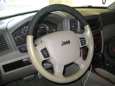 the interior of a car with steering wheel controls